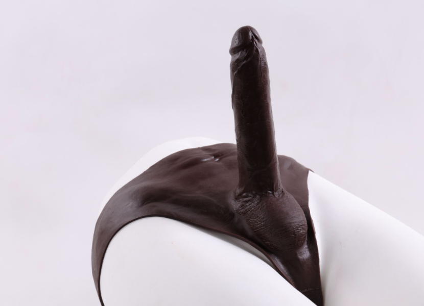 Scarface wearing a fake penis