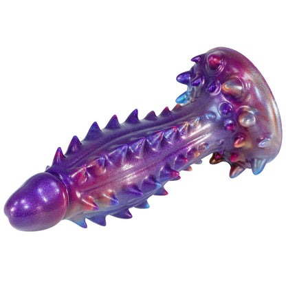 Barbed, irregularly shaped, realistic dildo with extra-large particles.