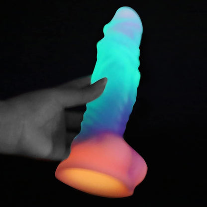 Luminous, irregularly shaped silicone massage stick/phallus