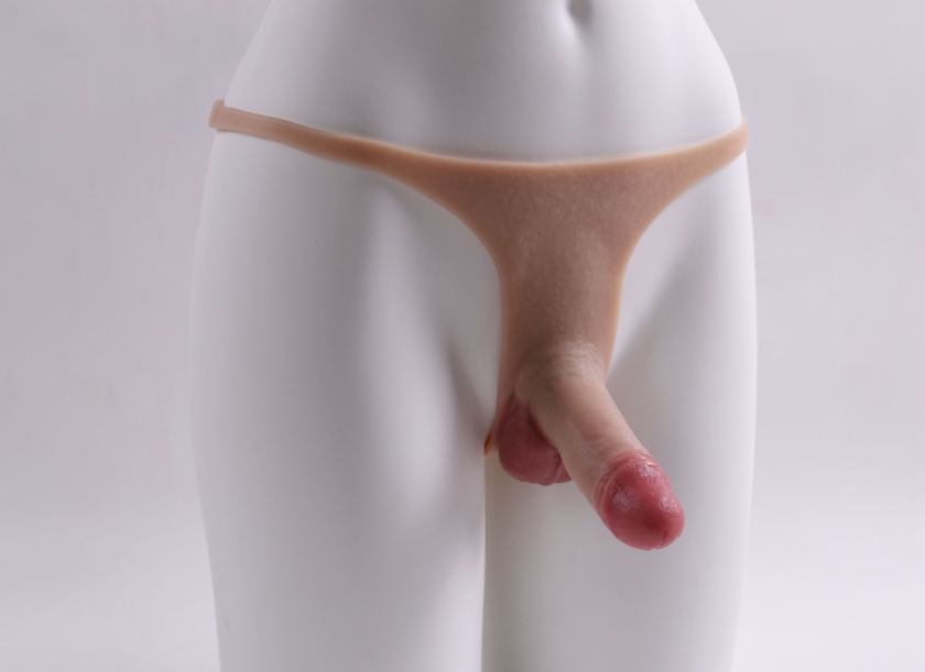 Little Cannon wearing a dildo