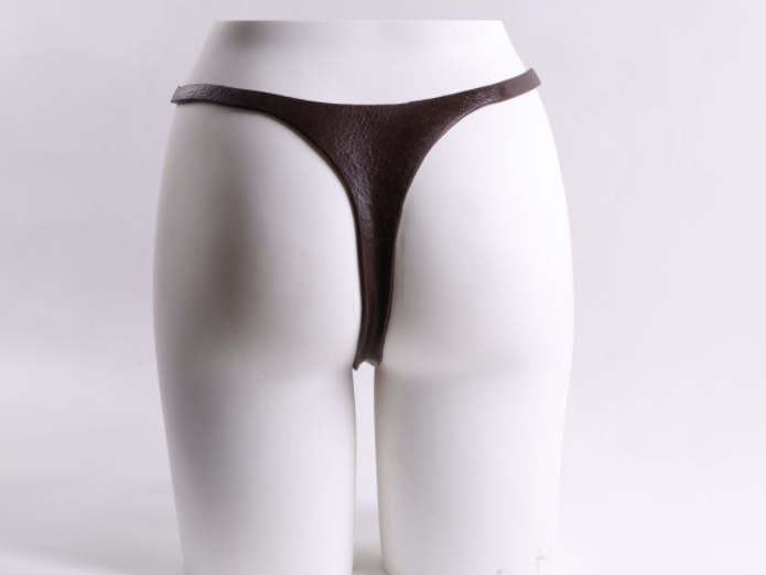 Little Cannon wearing a dildo