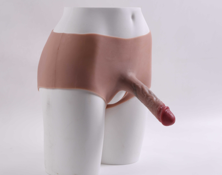 Mela (with cutouts) wearing a dildo