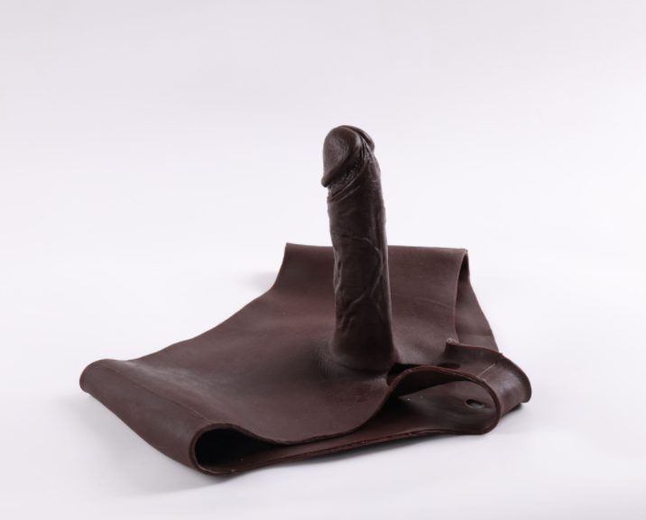 Mela (with cutouts) wearing a dildo