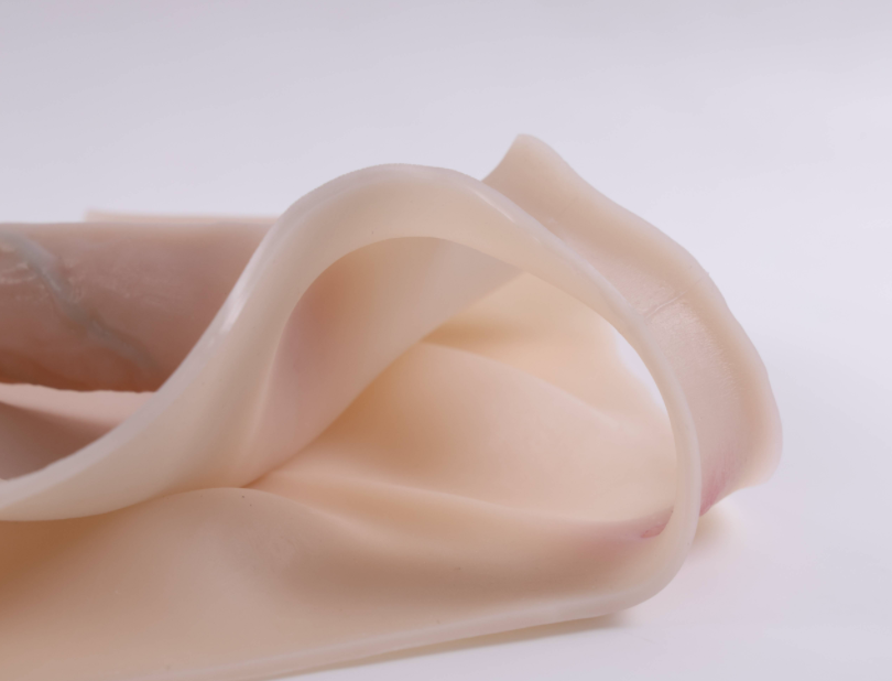 Mela (with cutouts) wearing a dildo