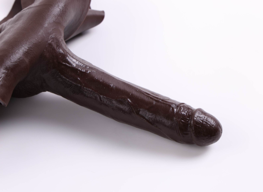 Scarface wearing a fake penis