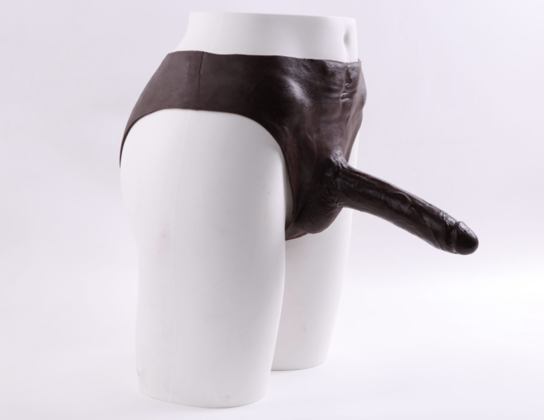 Scarface wearing a fake penis